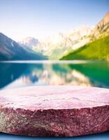 Stone Platform with Blurred Mountain Lake Background photo
