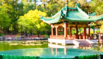 Green Jade Table Top In Front Of Chinese Pagoda photo