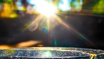 Sunlit Tabletop with Abstract Bokeh Background photo