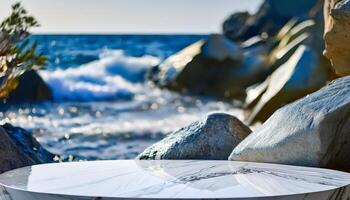 White Product Display with Blurry Ocean and Rocks Background photo
