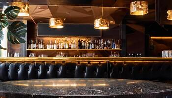 Empty Bar Table In Front Of Backlit Bar With Black Leather Booth Seating photo