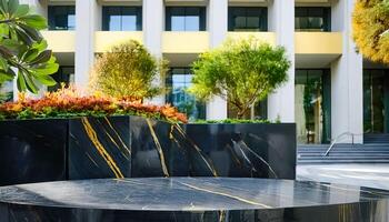 Black marble table with gold veins in front of modern building photo