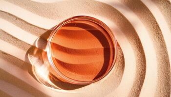 Glass Dish on Sandy Surface with Shadow Patterns photo