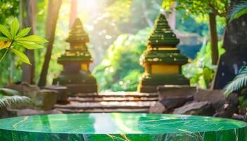 Green marble table top with a blurred background of tropical plants and a traditional Balinese building photo