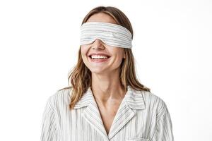 Blindfolded Woman in Pajamas Smiling photo