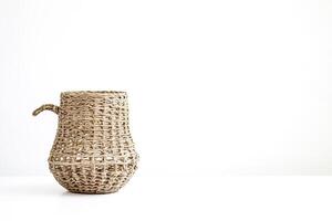 Wicker Basket with Handle on White Background photo