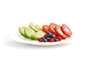 Close-up of melon slices, tomatoes, blueberries and raspberries on white plate photo