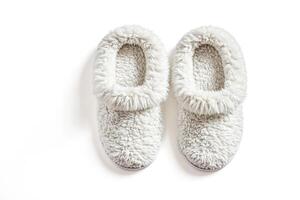 White Furry Slippers on White Background photo
