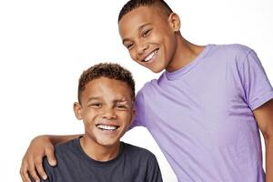 Two happy brothers smiling and laughing together photo