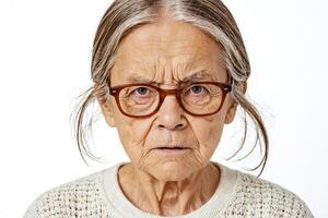Close-up portrait of an elderly woman with a stern expression photo