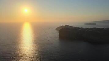 Sunset in Santorini Caldera - Aerial view at sunset of the volcano coasts of Santorini island in Greece video