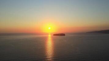 Sunset in Santorini Caldera - Aerial view at sunset of the volcano coasts of Santorini island in Greece video