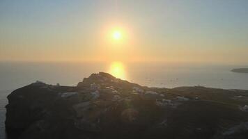 Sunset in Santorini Caldera - Aerial view at sunset of the volcano coasts of Santorini island in Greece video