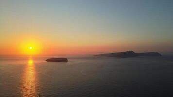 Sunset in Santorini Caldera - Aerial view at sunset of the volcano coasts of Santorini island in Greece video