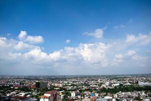 High angle aerial Settlement semarang Indonesia with cloudy blue sky background photo