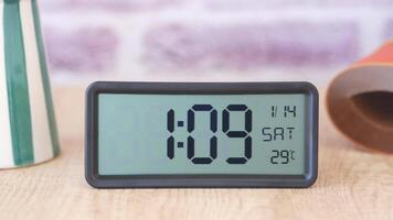 Start your day right by placing a digital alarm clock on a table to wake up in the morning video