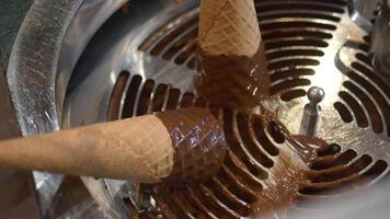 Enjoy the delightful and delicious experience of Chocolate Ice Cream served in Waffle Cones video
