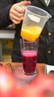 Enjoy a Refreshing Beetroot Juice that is Beautifully Served in a Clear Glass for Sipping video
