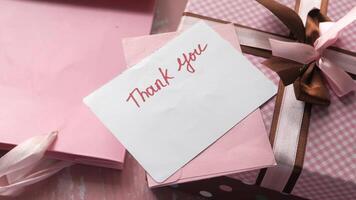 thank you message and envelope on wooden table video