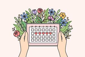 Menstrual cycle calendar in hands of woman and flowers, for tracking of PMS days vector