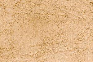 Abstract rough beige texture. Architectural abstract background. Plastered building wall. photo