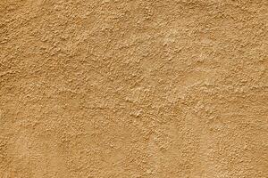 Abstract rough beige texture. Architectural abstract background. Plastered building wall. photo