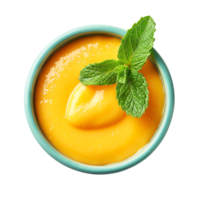 Overhead view of a bowl of creamy mango puree garnished with fresh mint leaves, isolated on a transparent background. png
