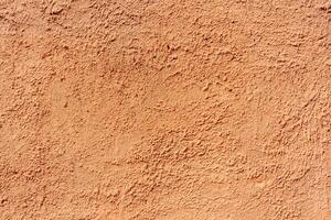 Abstract rough beige texture. Architectural abstract background. Plastered building wall. photo
