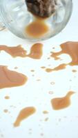 A drink was accidentally spilled on a desk with a laptop and glasses, creating a mess video