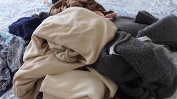 messy bed with cloths in early morning , messy bed after waking up video