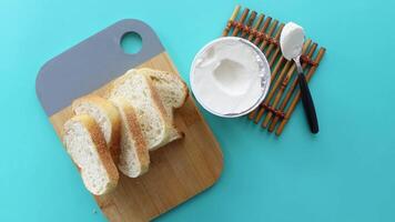 Delicious Freshly Sliced Bread Presented with a Creamy Spread on a Stylish Cutting Board video