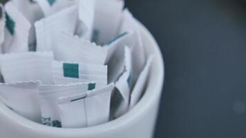 white sugar in a paper packet on table video