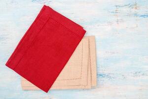 Red and white canvas napkins on the table. photo