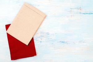 Red and white canvas napkins on the table. photo