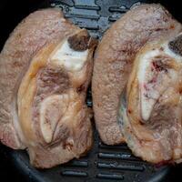 Breast of beef on the bone. Cooking in the kitchen. photo