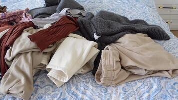 messy bed with cloths in early morning , messy bed after waking up video