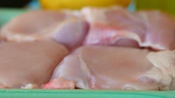 raw breast chicken meat in a plastic packet on table video