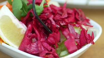 Enjoy a colorful and vibrant cabbage salad that features refreshing lemon and fresh herbs video