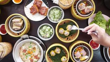 top down view to table full with streamers with dumpling dimsum for morning breakfast chinese meal video