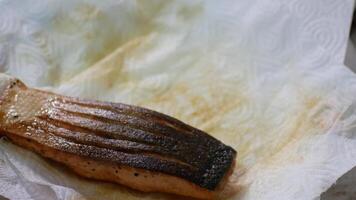 close up with selective focus to fried sear grill salmon filet steak serving in plate video