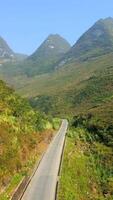Aerial view of scenic road in the mountains on the Ha Giang Loop in Vietnam. video