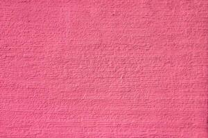 Abstract pink background. Pink color of rough surface. photo