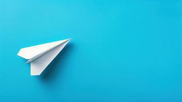 paper airplane on blue background photo