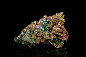 Macro of the stone bismuth mineral on a black background photo