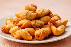 Pisang molen, Indonesian traditional food made from banana wrap with sheet of pastry dough and then fried photo