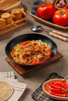 Tongseng is beef stew dish in curry-like soup, with vegetables and sweet soy sauce photo