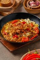 Tongseng is beef stew dish in curry-like soup, with vegetables and sweet soy sauce photo