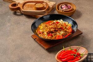 Tongseng is beef stew dish in curry-like soup, with vegetables and sweet soy sauce photo
