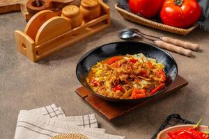Tongseng is beef stew dish in curry-like soup, with vegetables and sweet soy sauce photo
