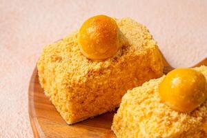 Nastar Cake is vanilla sponge based with crumbs, layered by pineapple jam and cheese cream. Topping with nastar cookies crumbs photo